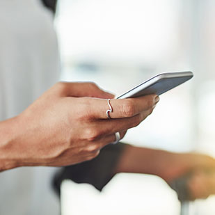 hands holding a moble