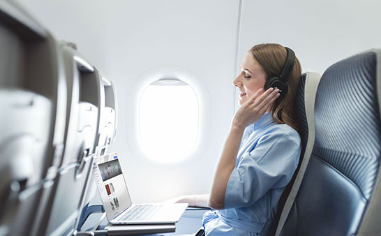 woman onboard with headphones
